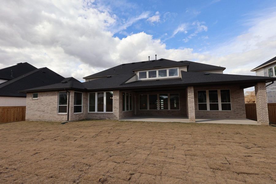 Exterior details and patio area of a home in Dunham Pointe, Cypress (Image 22).