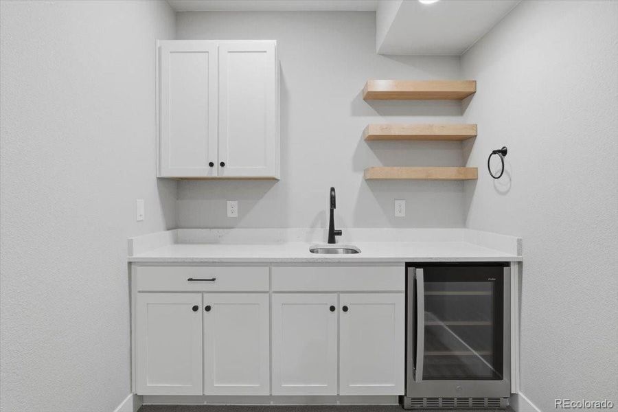 Need a beverage to wash down that movie popcorn? No need to go upstairs, there's a beverage cooler in the bar!