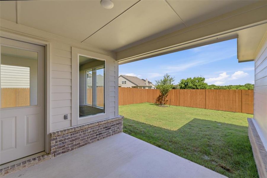 Exterior details and patio area of a home in Covenant Park, Springtown (Image 20).