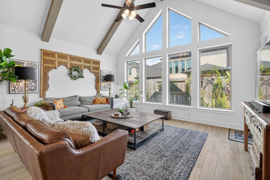This large Living Room featuring a Cathedral Ceiling, Large Windows & a view of the Backyard Space! 31418 Golden Cliffs Ln., Fulshear, TX 77441 This large Living Room featuring a Cathedral Ceiling, Large Windows & a view of the Backyard Space! 31418 Golden Cliffs Ln., Fulshear, TX 77441