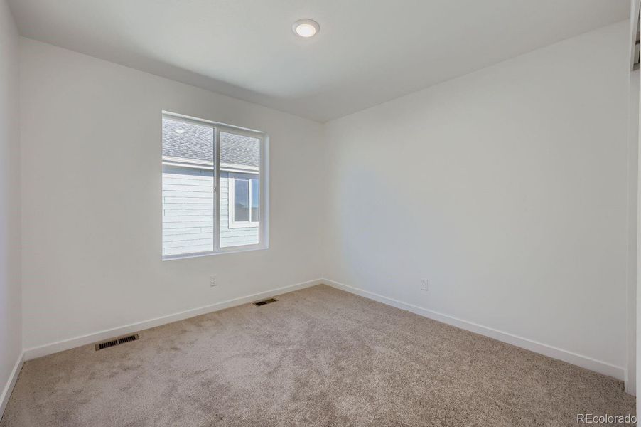 Spacious, unfurnished interior of a new home in Percheron: The Explorer Collection, Colorado Springs (Image 9).