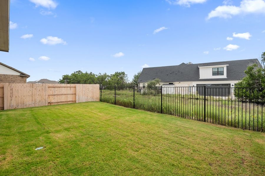 Front exterior of a new home in Terrace Collection at Lariat, Liberty Hill, TX, highlighting curb appeal (Image 28). Front exterior of a new home in Terrace Collection at Lariat, Liberty Hill, TX, highlighting curb appeal (Image 28).