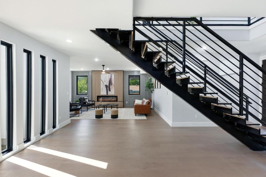 Stairway featuring wood finished floors and recessed lighting Stairway featuring wood finished floors and recessed lighting