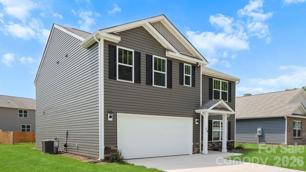 Front exterior of a new home in Wildbrook Village, Waynesville, NC, highlighting curb appeal (Image 2). Front exterior of a new home in Wildbrook Village, Waynesville, NC, highlighting curb appeal (Image 2).