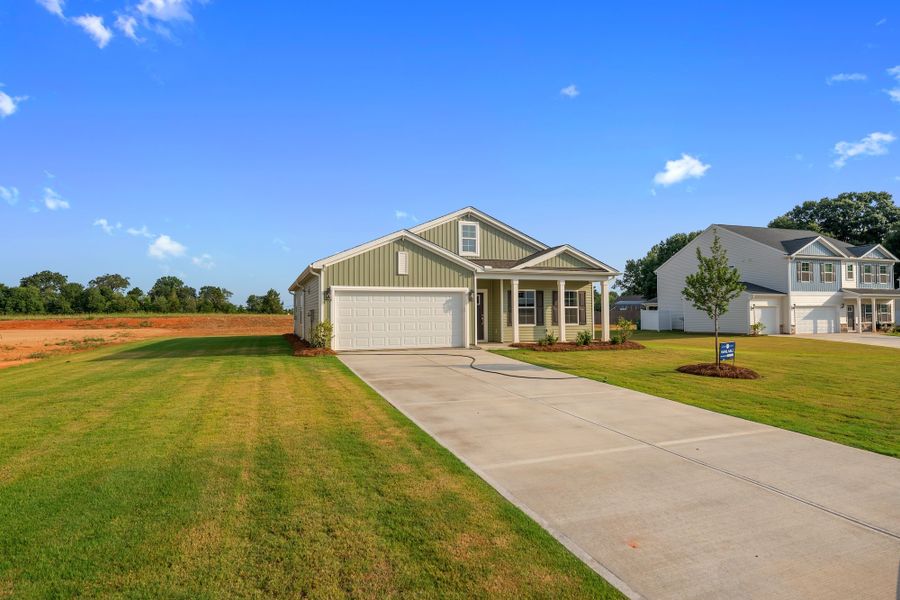 Front exterior of a new home in Dove Hollow, Chesnee, SC, highlighting curb appeal (Image 2). Front exterior of a new home in Dove Hollow, Chesnee, SC, highlighting curb appeal (Image 2).