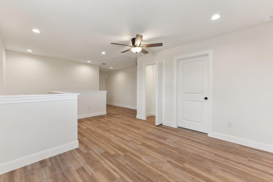 Upstairs Family Area  with recessed lighting, light wood finished floors, a ceiling fan, and baseboards