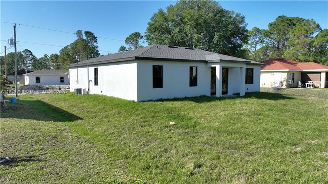 Exterior details and patio area of a home in , Lehigh Acres (Image 2).