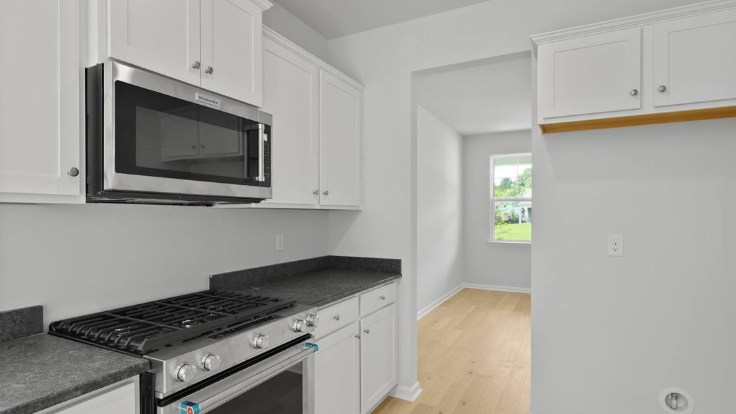 Representative furnished interior of a home built from the FORRESTER by D.R. Horton in Founders Corner, Summerville (Image 6).