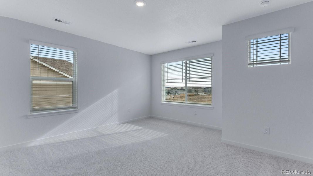 Spacious, unfurnished interior of a new home in Trails at Crowfoot, Parker (Image 29).