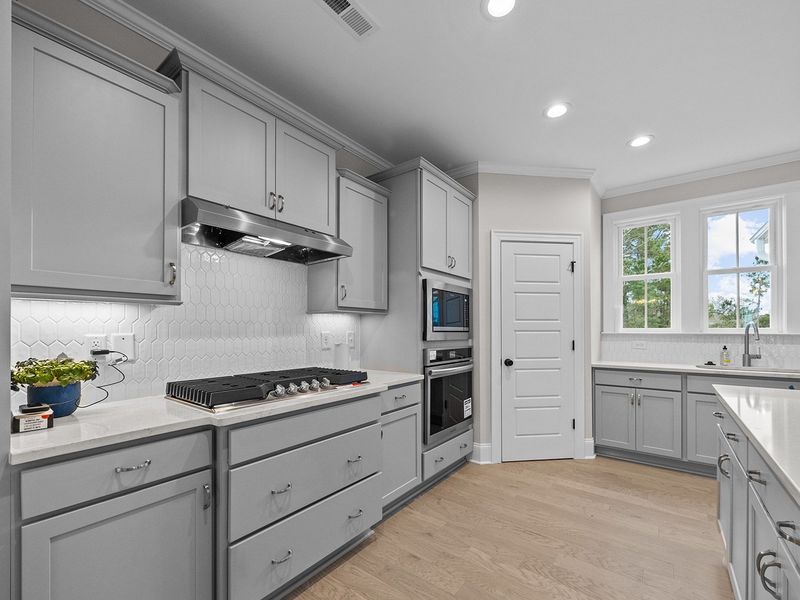 Representative furnished interior of a home built from the The Highland by RobuckHomes in Windwater, Hampstead (Image 7).