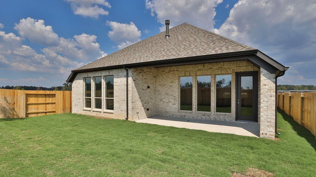 Exterior details and patio area of a home in Artavia 50', Conroe (Image 2).