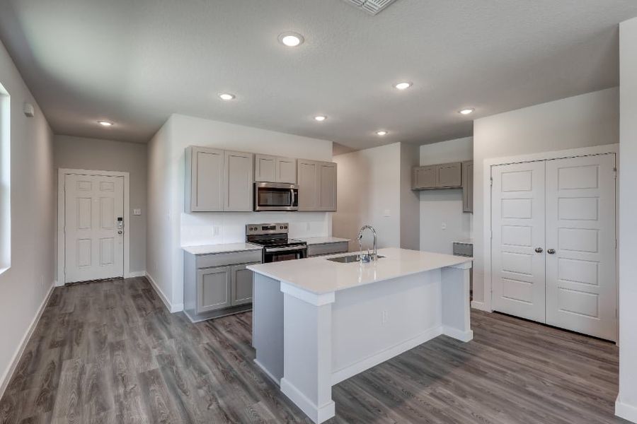 A kitchen with white cabinets. A kitchen with white cabinets.