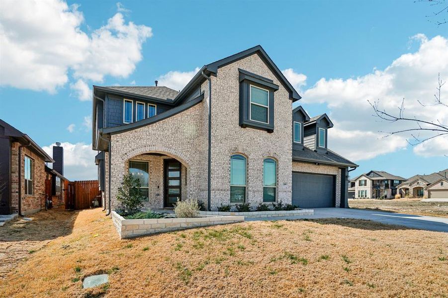 Front exterior of a new home in , Godley, TX, highlighting curb appeal (Image 22).