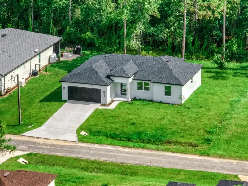 Front exterior of a new home in , Sebring, FL, highlighting curb appeal (Image 2). Front exterior of a new home in , Sebring, FL, highlighting curb appeal (Image 2).
