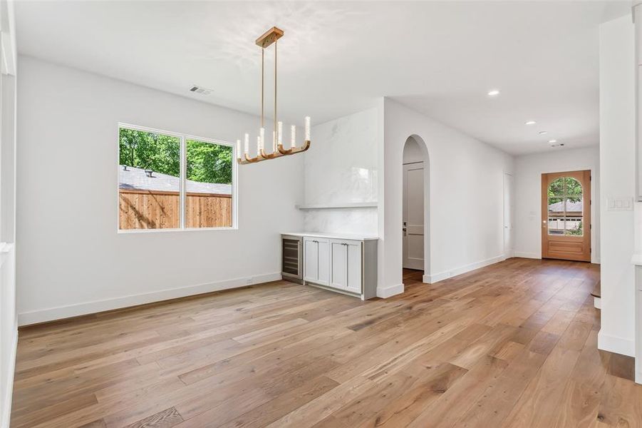 Striking marble wall above custom cabinets