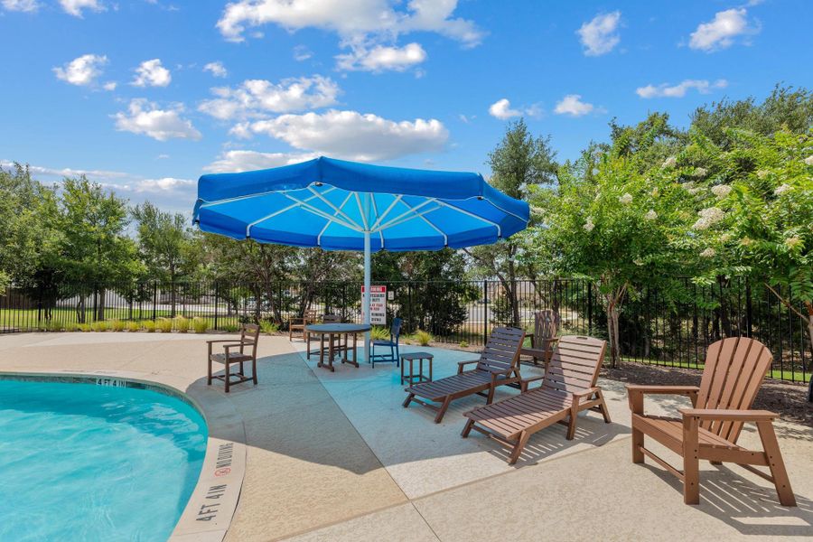 Relax poolside under the shade of umbrellas, surrounded by lush landscaping and a securely fenced perimeter. Relax poolside under the shade of umbrellas, surrounded by lush landscaping and a securely fenced perimeter.