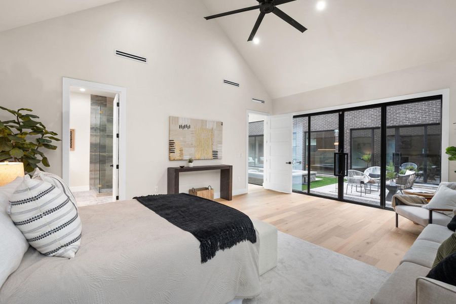 Vaulted ceiling with integrated lighting and black ceiling fan