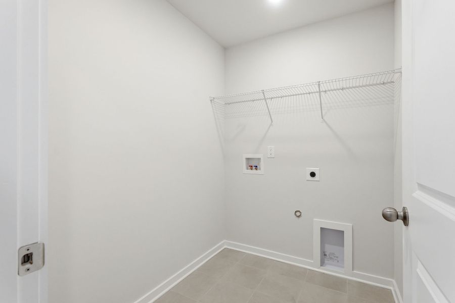 A shower with a tile floor.