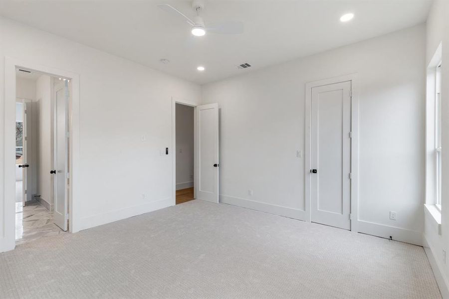 One of the two bedrooms at the rear that share a Jack and Jill bath.