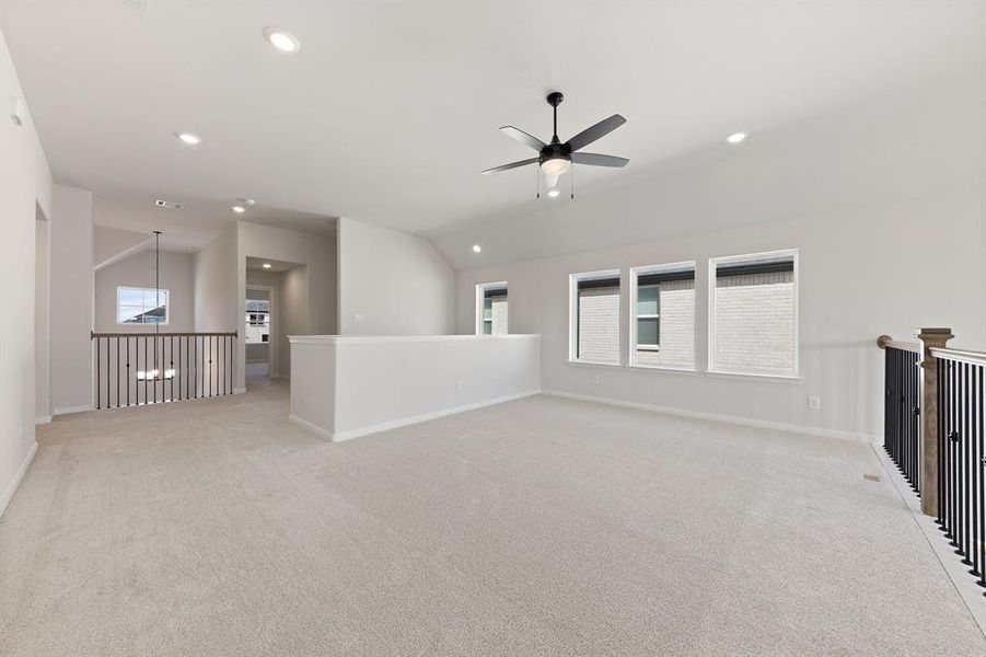 Light, bright and airy, the family fun time never ends in this over the top game room!