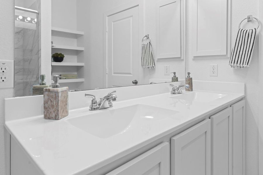 Every detail of this bathroom is designed for both beauty and function, with stylish countertops, extra storage, and a bright, clean look throughout.  You even have a medicine cabinet for all your medicine and private things.