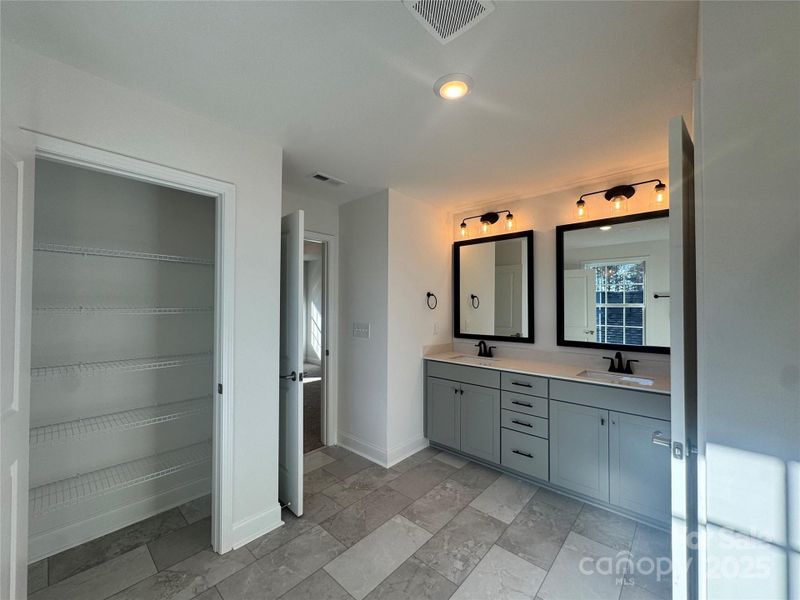 Spacious linen closet in primary bathroom
