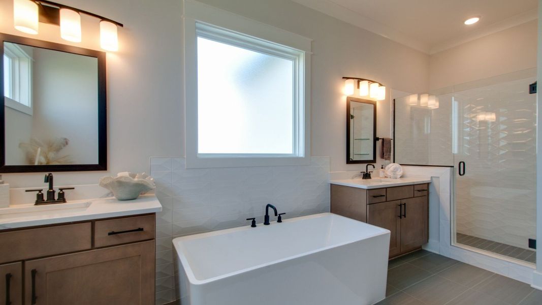 Primary Bathroom with split dual-vanity, shower, and freestanding tub Primary Bathroom with split dual-vanity, shower, and freestanding tub