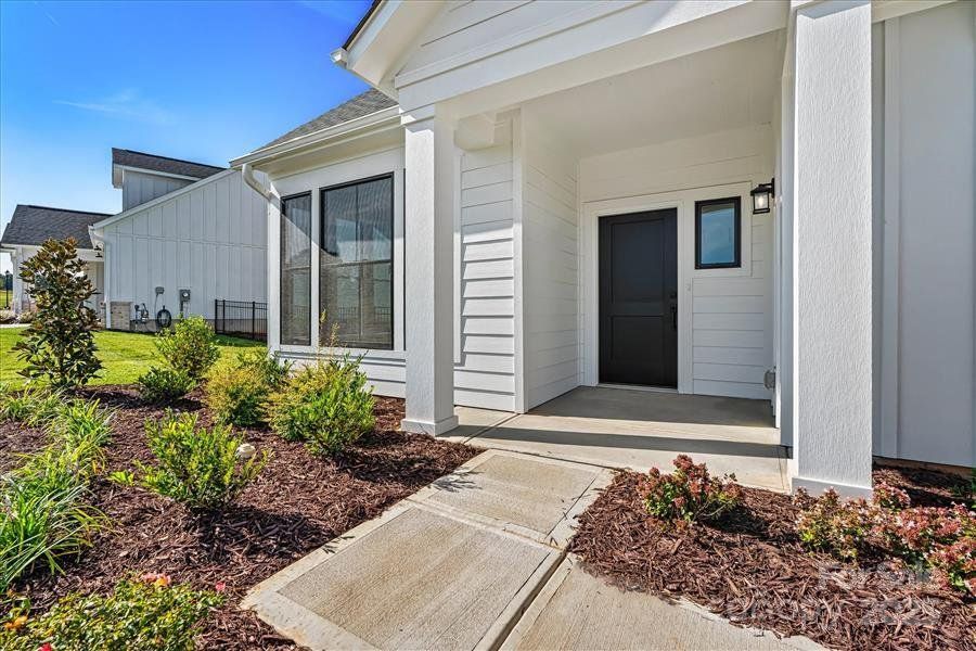 Exterior details and patio area of a home in The Courtyards at Lake Davidson, Mooresville (Image 23).
