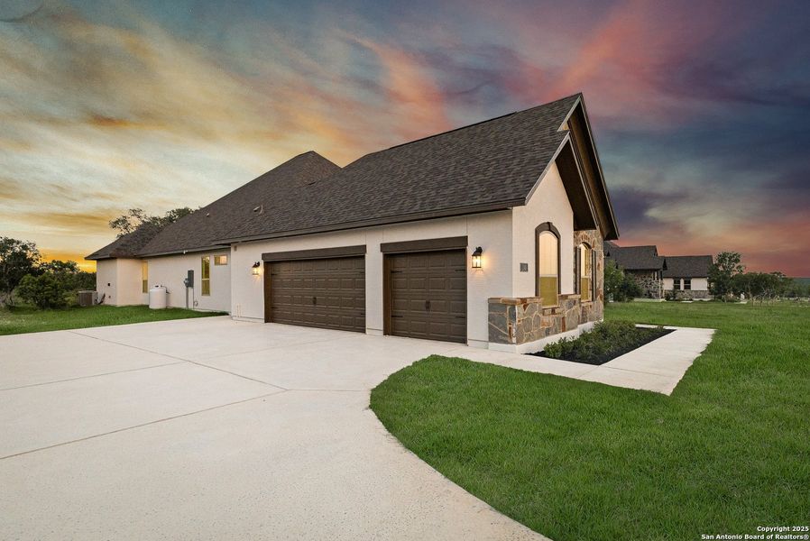 Front exterior of a new home in Potranco Acres, Castroville, TX, highlighting curb appeal (Image 21).
