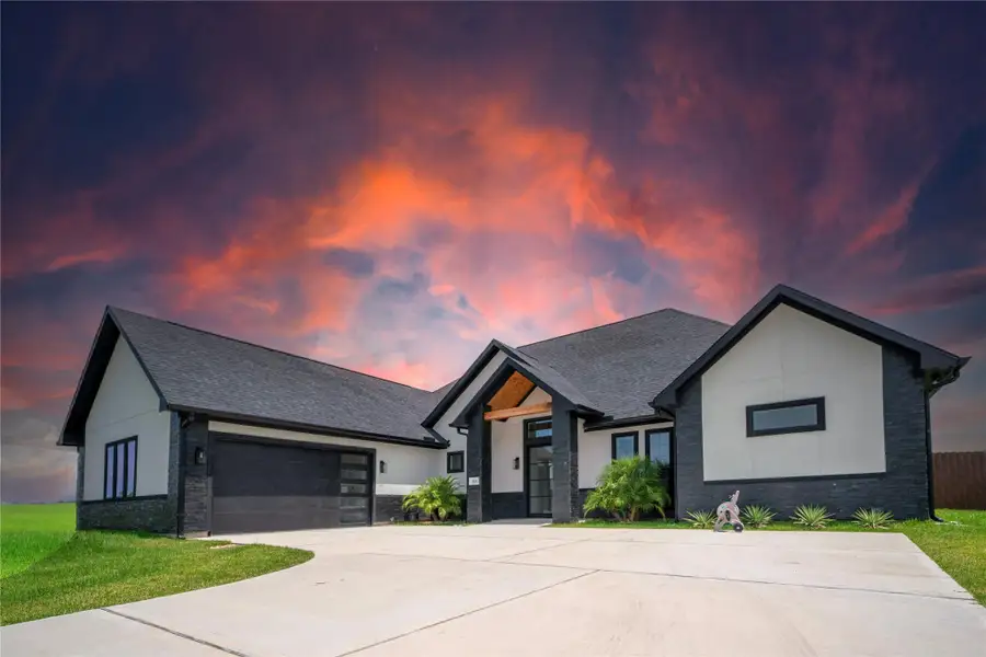 Front exterior of a new home in , Hockley, TX, highlighting curb appeal (Image 2).