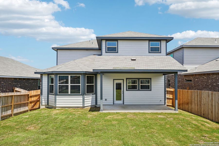 Front exterior of a new home in Comanche Ridge, San Antonio, TX, highlighting curb appeal (Image 25). Front exterior of a new home in Comanche Ridge, San Antonio, TX, highlighting curb appeal (Image 25).