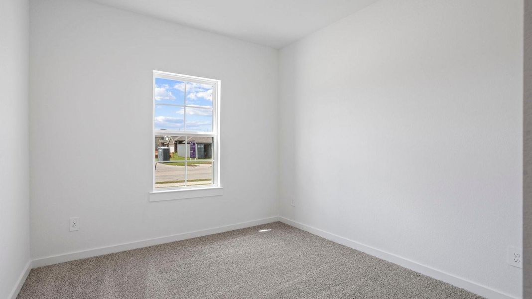 Spacious, unfurnished interior of a new home in Caldwell Crossing, Iowa Colony (Image 16).