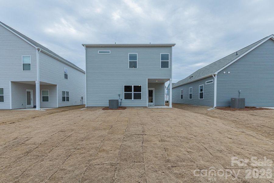 Exterior details and patio area of a home in Country Club Village, Salisbury (Image 18).