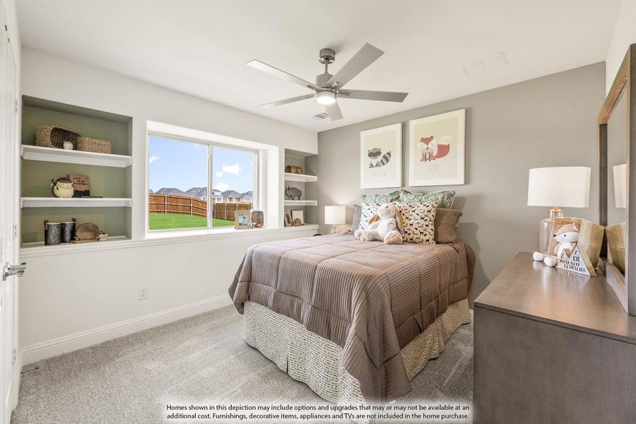 Bedroom with built-in shelves, ceiling fan, carpet flooring, and a window overlooking a backyard