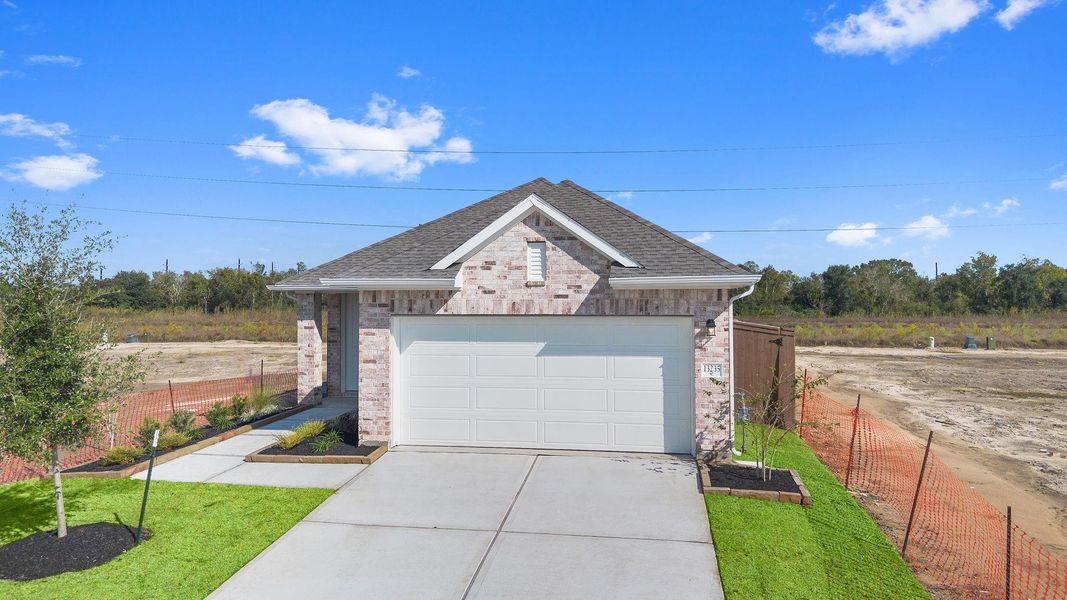 Front exterior of a new home in Creekhaven, Rosharon, TX, highlighting curb appeal (Image 16).