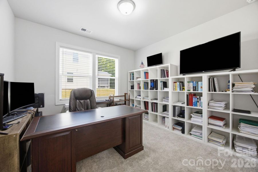 Guest bedroom on the main floor. Currently being used as another office.