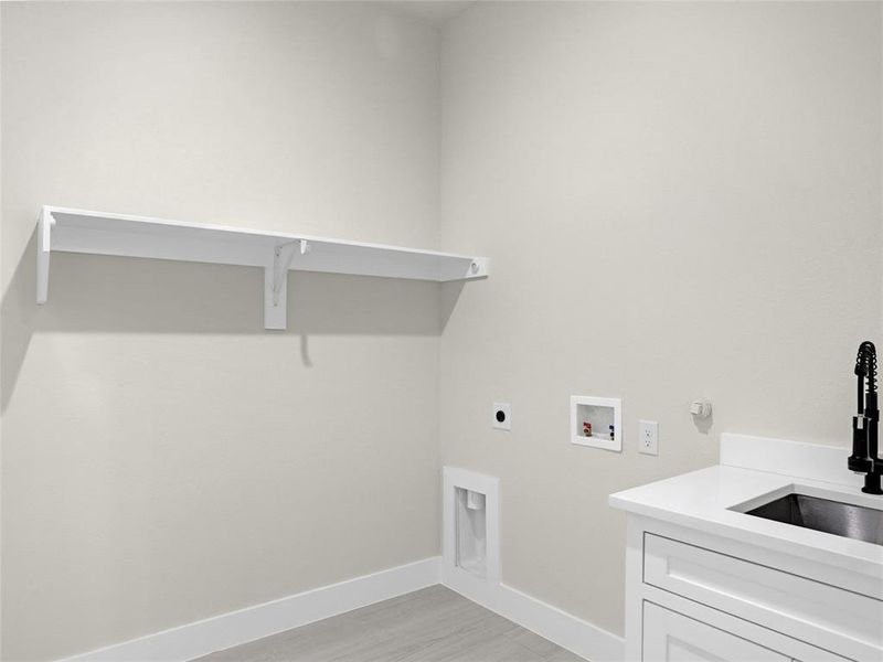 Washroom featuring gas dryer hookup, sink, cabinets, washer hookup, and hookup for an electric dryer