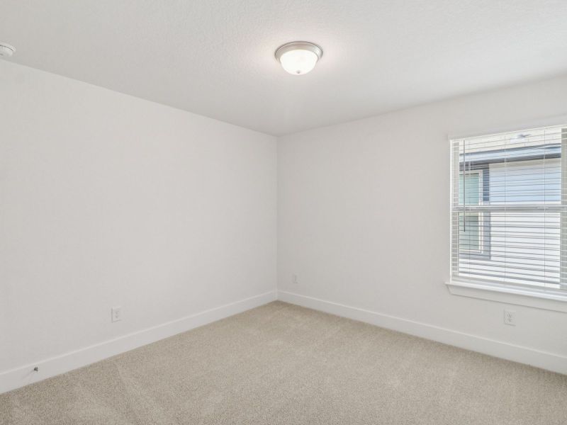 Guest bedroom in the Matador floorplan at a Meritage Homes community. Guest bedroom in the Matador floorplan at a Meritage Homes community.