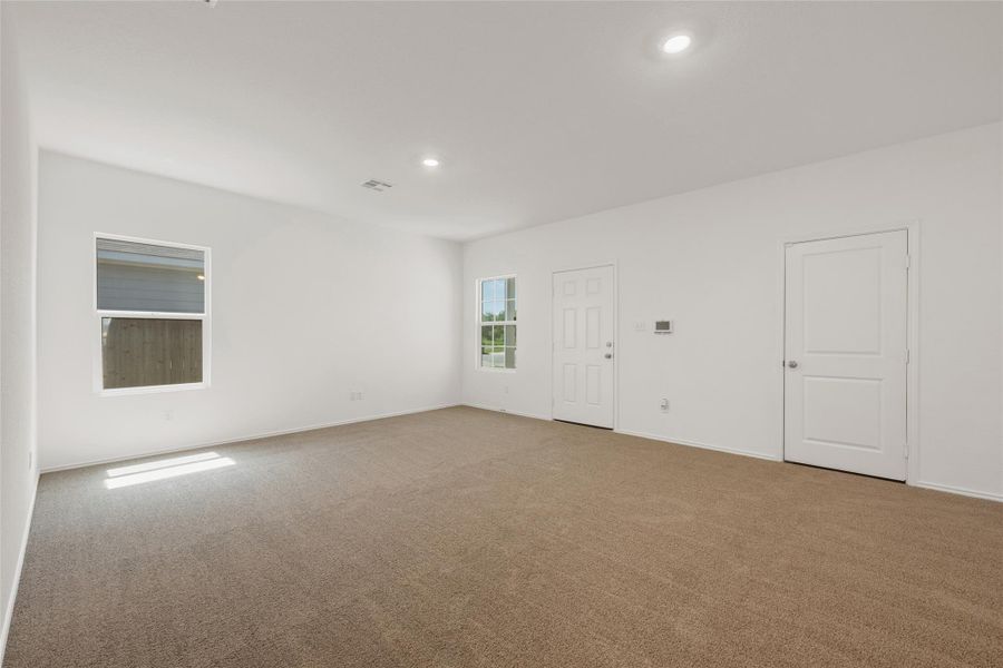 Unfurnished room featuring carpet floors and recessed lighting Unfurnished room featuring carpet floors and recessed lighting