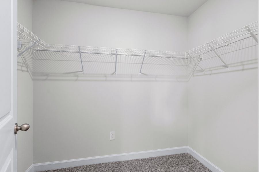 The walk-in closet off of the primary bathroom offers an abundance of space. The walk-in closet off of the primary bathroom offers an abundance of space.