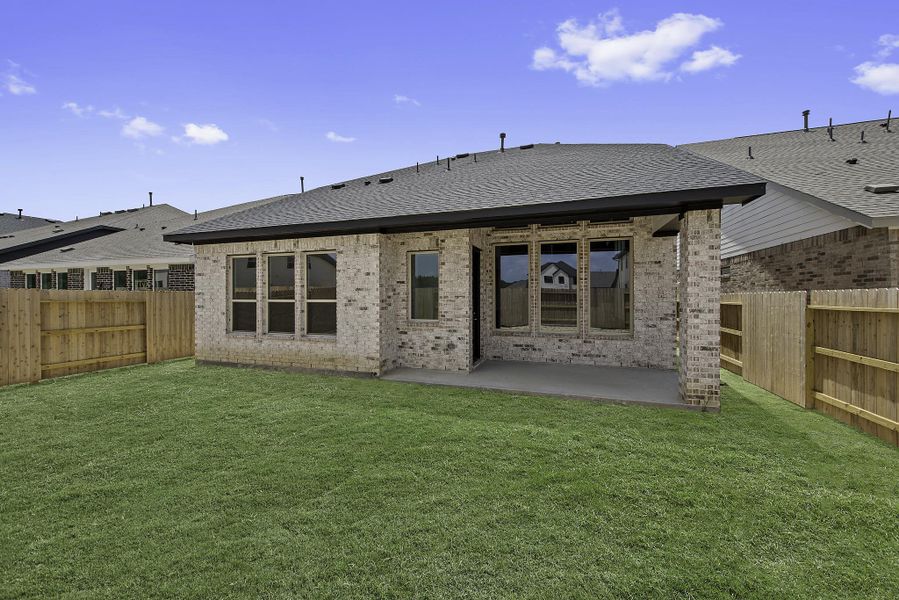 Exterior details and patio area of a home in The Trails, New Caney (Image 3).