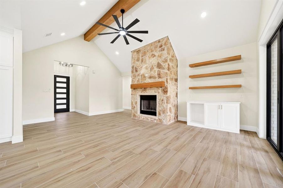 Vaulted ceiling featuring an exposed wood beam and ceiling fan Vaulted ceiling featuring an exposed wood beam and ceiling fan