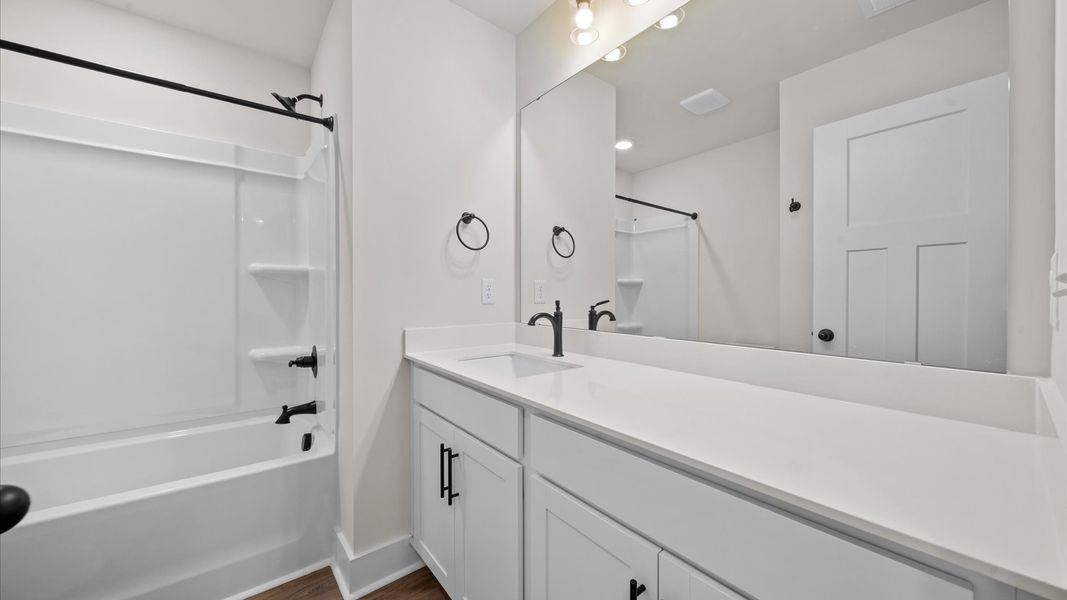 Top-notch bathroom with current fixtures, tasteful materials, and elevated charm Top-notch bathroom with current fixtures, tasteful materials, and elevated charm