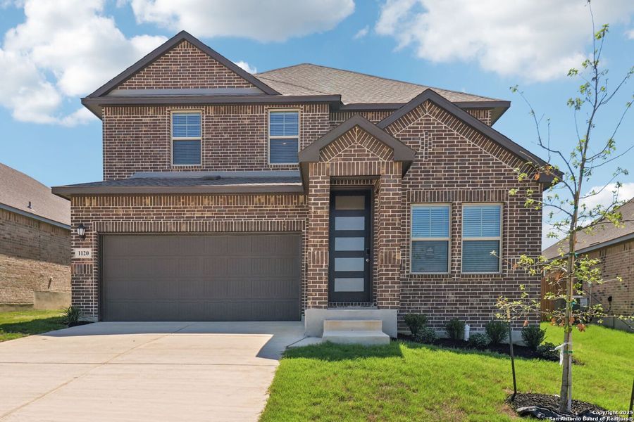 Front exterior of a new home in Arcadia Ridge - Premier Series, San Antonio, TX, highlighting curb appeal (Image 1).