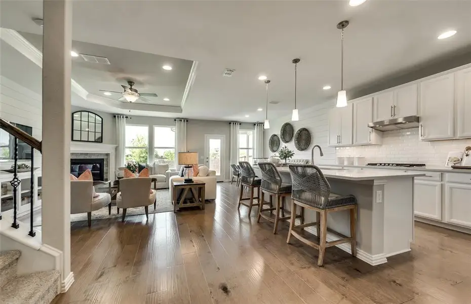 *Model Representation - Large island overlooking gathering room and dining areas