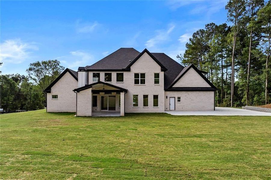 Front exterior of a new home in , Loganville, GA, highlighting curb appeal (Image 36).