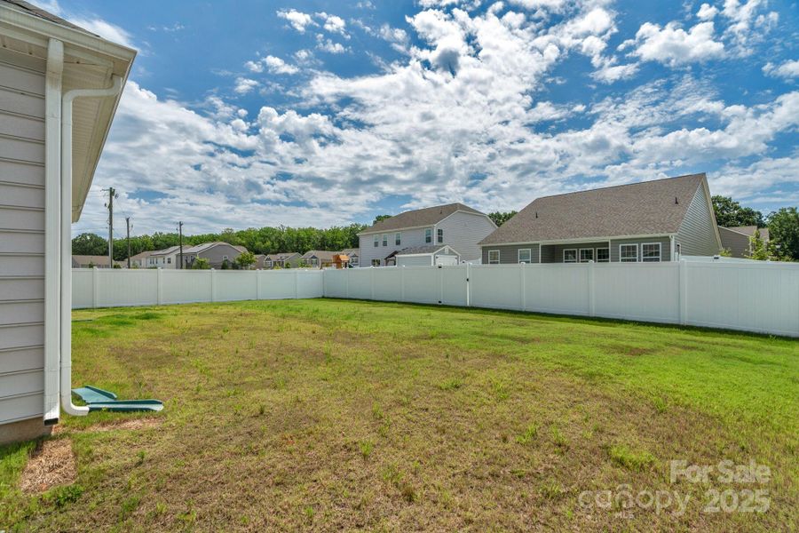 Front exterior of a new home in Crossroads, Locust, NC, highlighting curb appeal (Image 20). Front exterior of a new home in Crossroads, Locust, NC, highlighting curb appeal (Image 20).