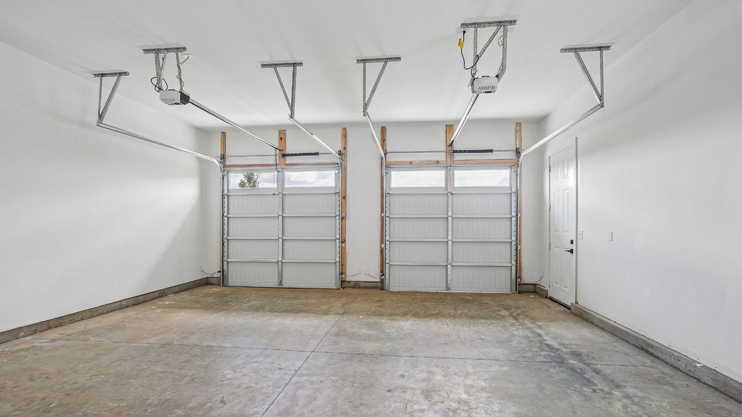 Painted Two-Car Garage with dual-bay doors