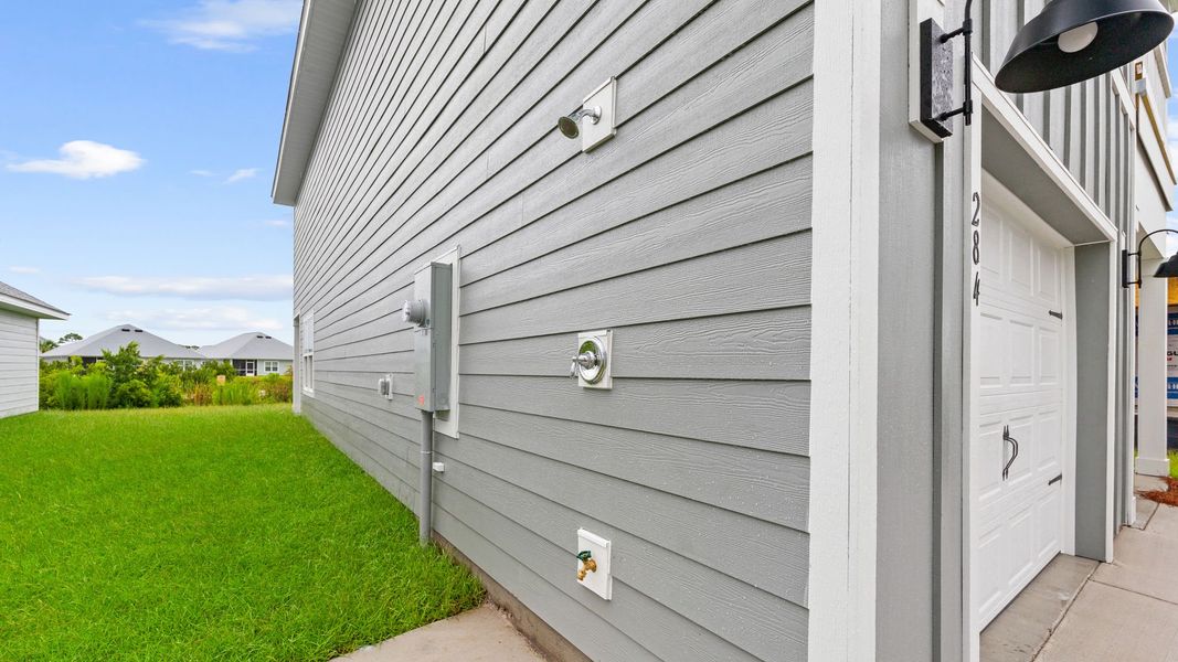 Exterior details and patio area of a home in WindMark Beach, Port Saint Joe (Image 3).