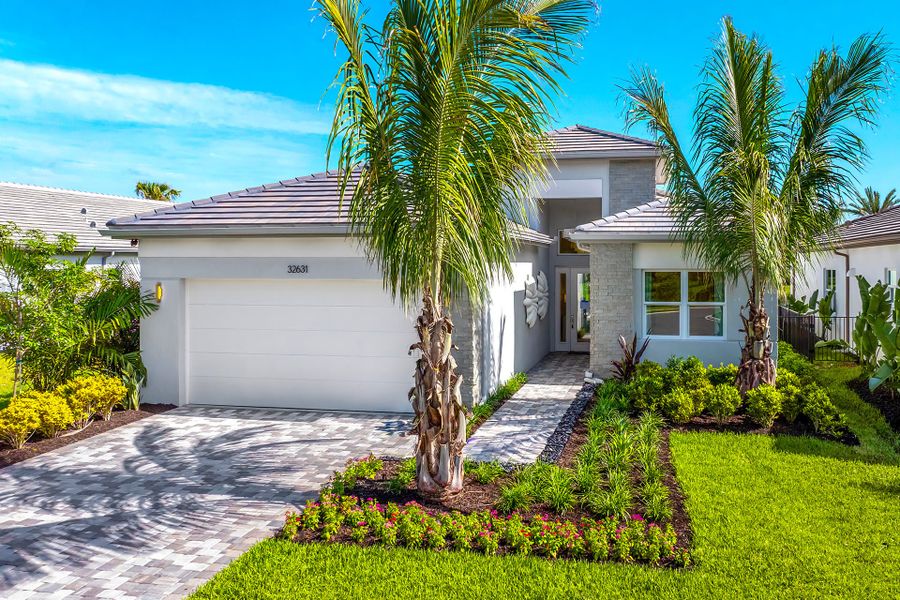 Representative exterior photo of a completed home built from the Isabella by GL Homes in Valencia Ridge (55+), Wesley Chapel, FL (Image 2). Representative exterior photo of a completed home built from the Isabella by GL Homes in Valencia Ridge (55+), Wesley Chapel, FL (Image 2).